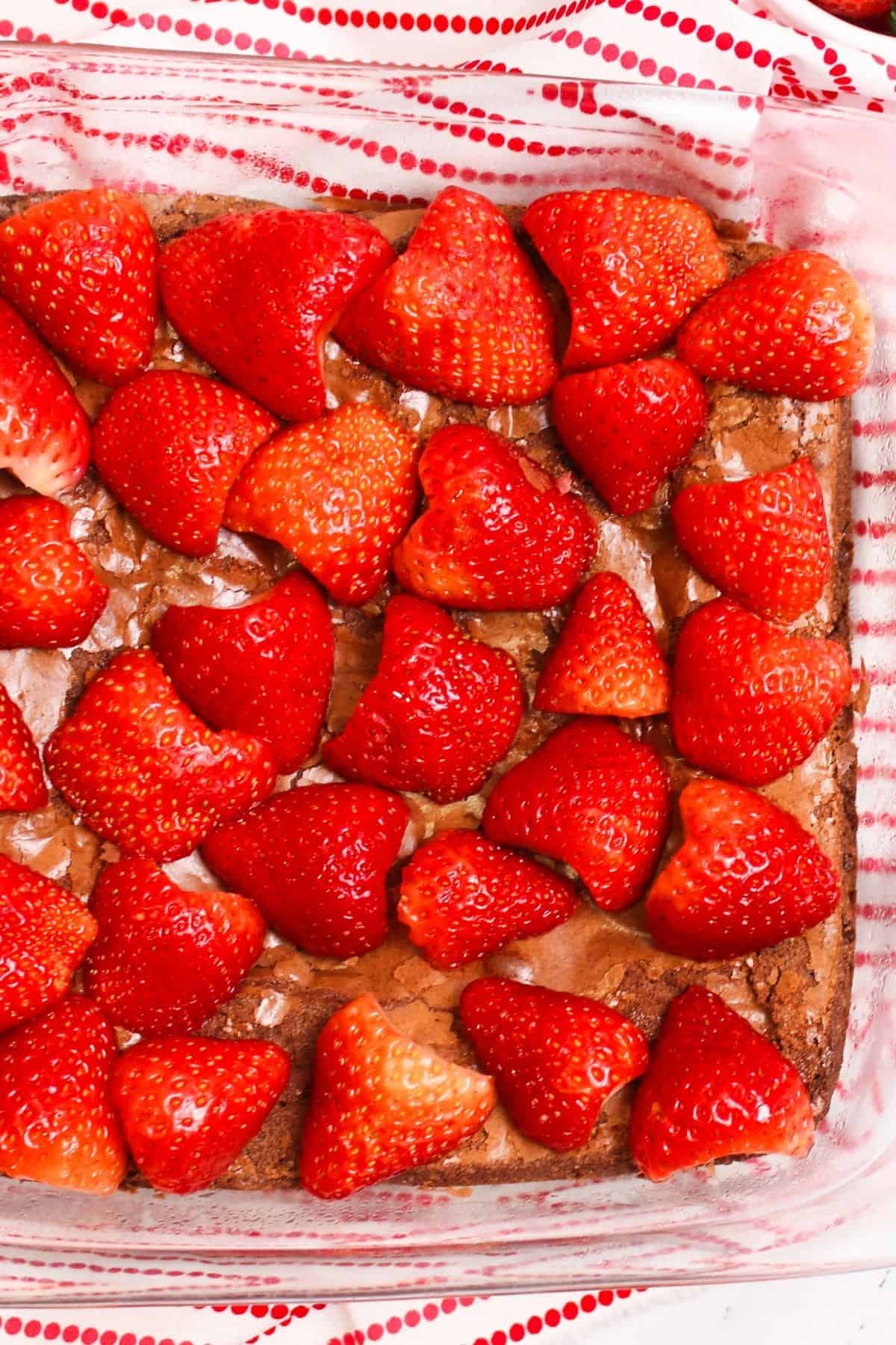 strawberries placed on top of brownies