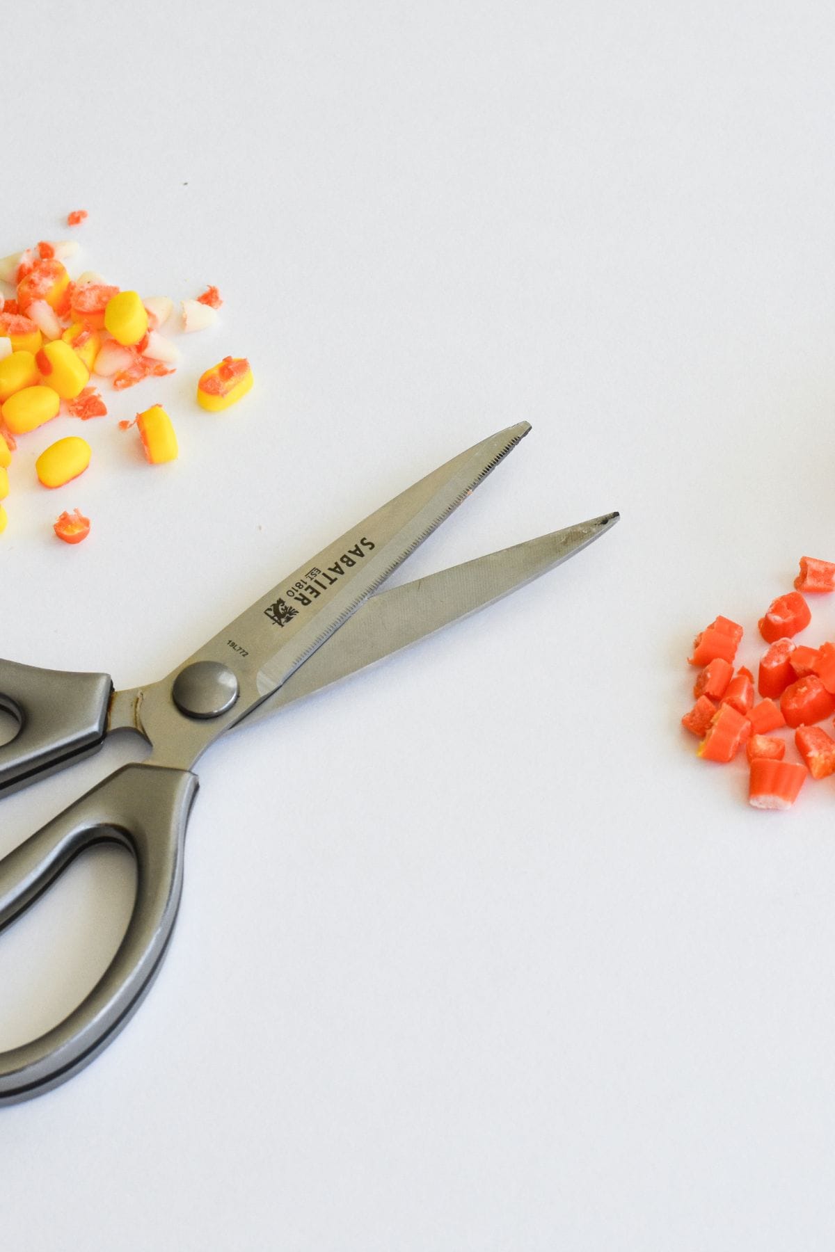 Cutting candy corn to make into turkey noses.