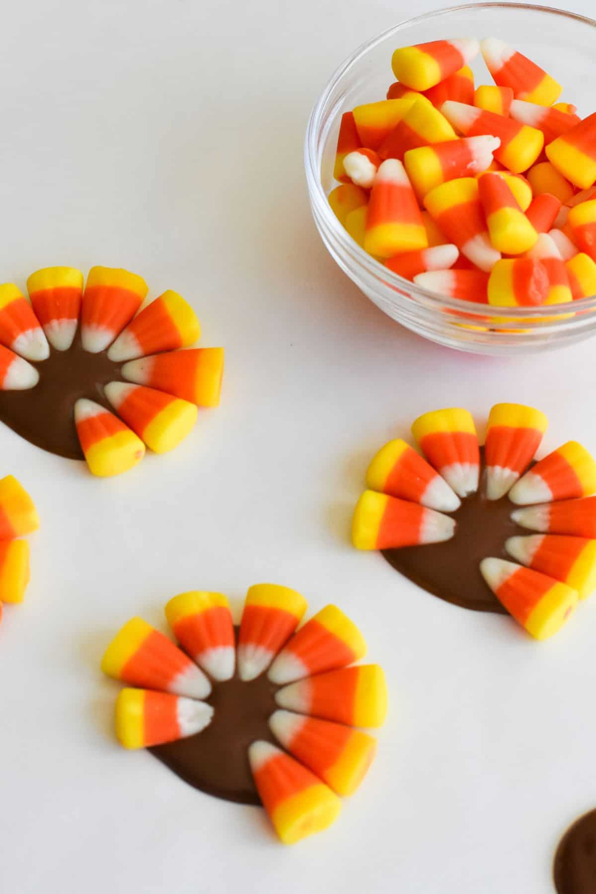 Adding candy corn to make a turkey tail.